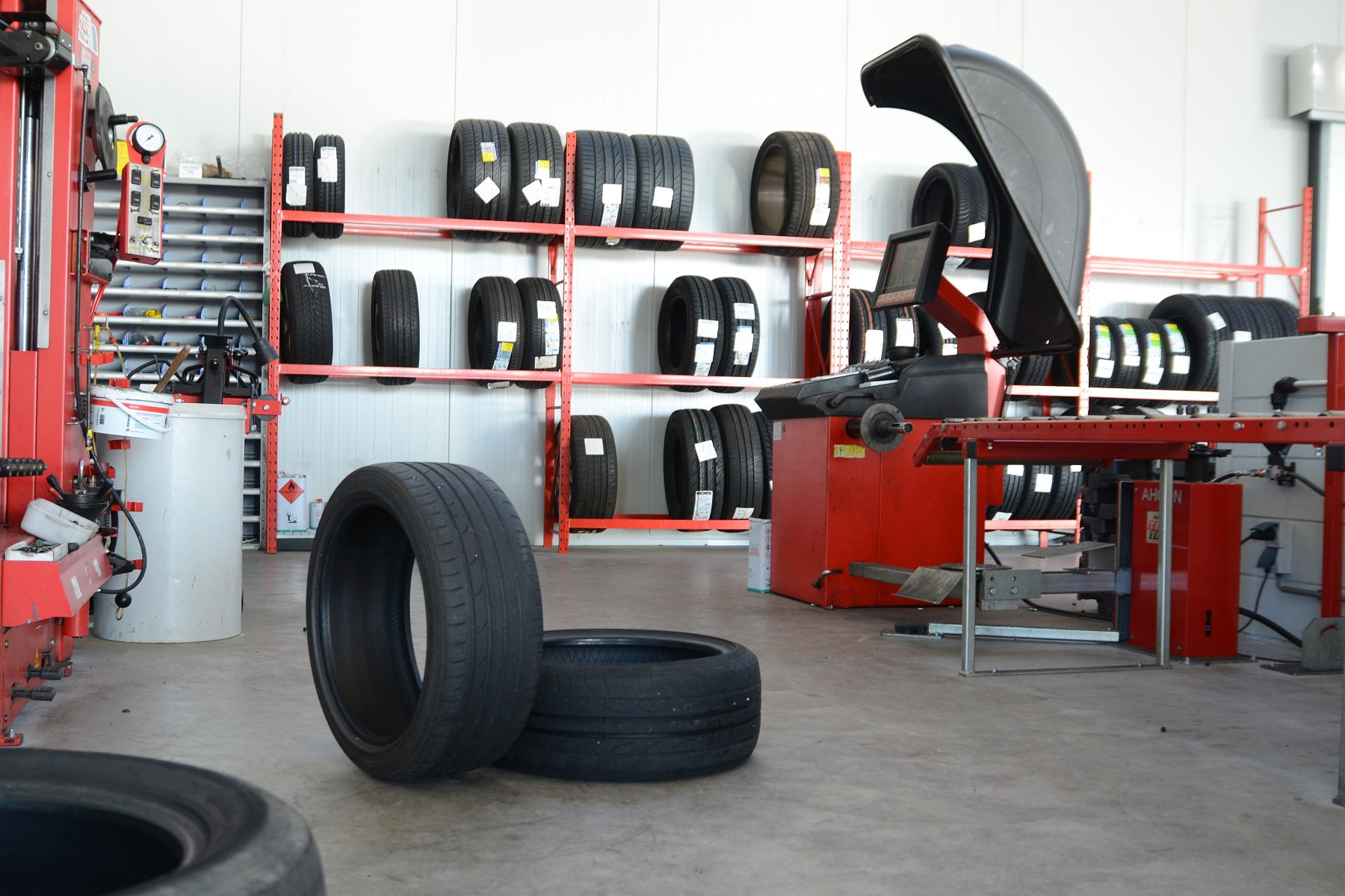 Tyre workshop interior with tyre racks and wheel service equipment